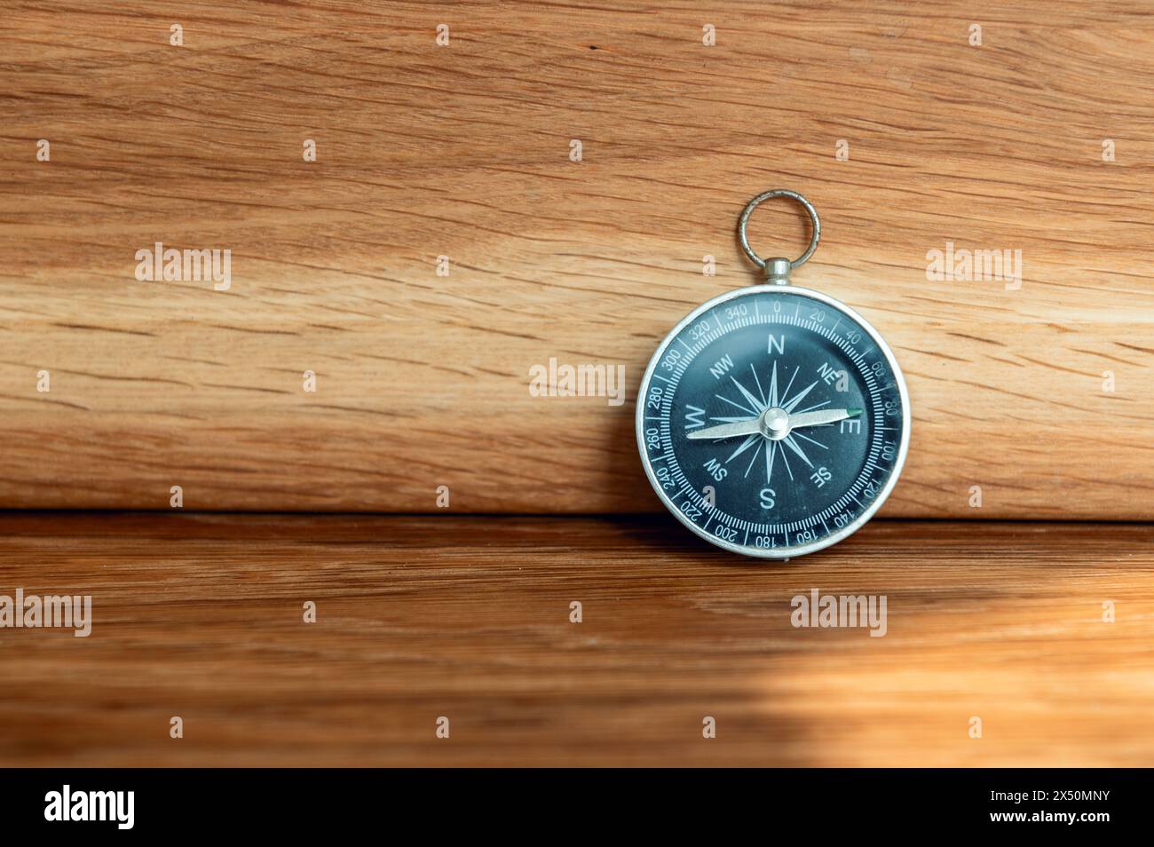 Compass on wooden background with copy space using as direction Stock Photo