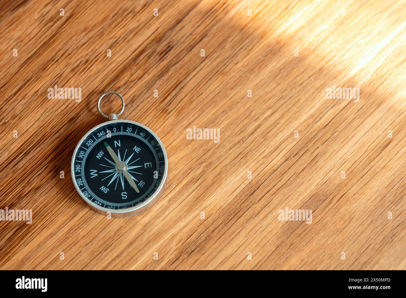 Compass on wooden background with copy space using as direction Stock Photo