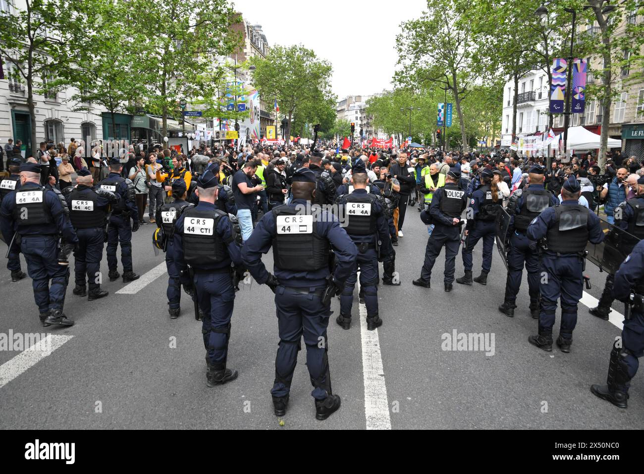 Paris,France,1st of May 2024.Thousands of people protested and celebrated on mayday in Paris.  Labour unions,workers,students and others marched through the streets. Some protesters turned violent,started fires and destroyed businesses. Stock Photo