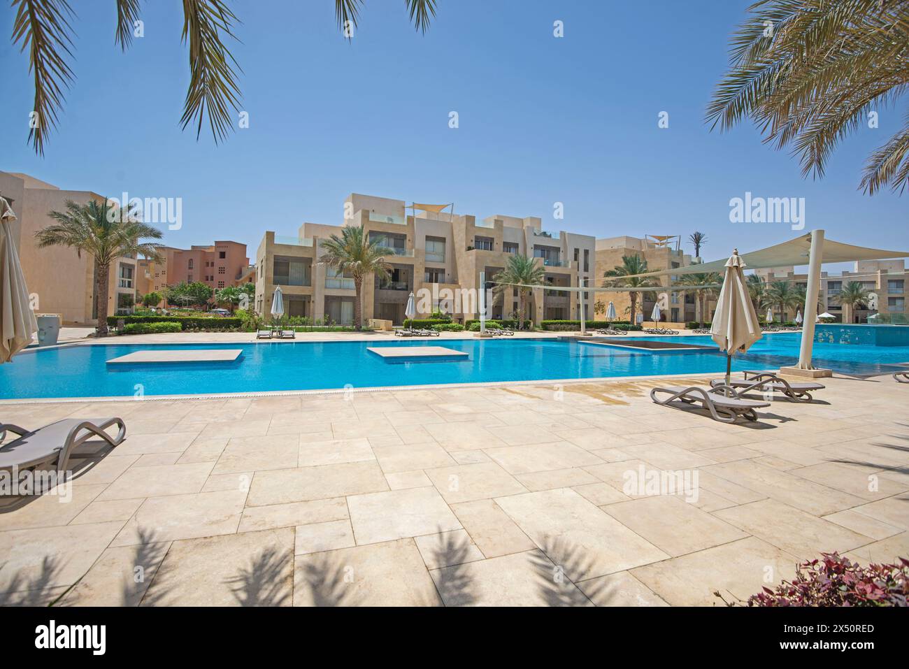 View of Luxury apartment in tropical resort with furniture and swimming pool ...