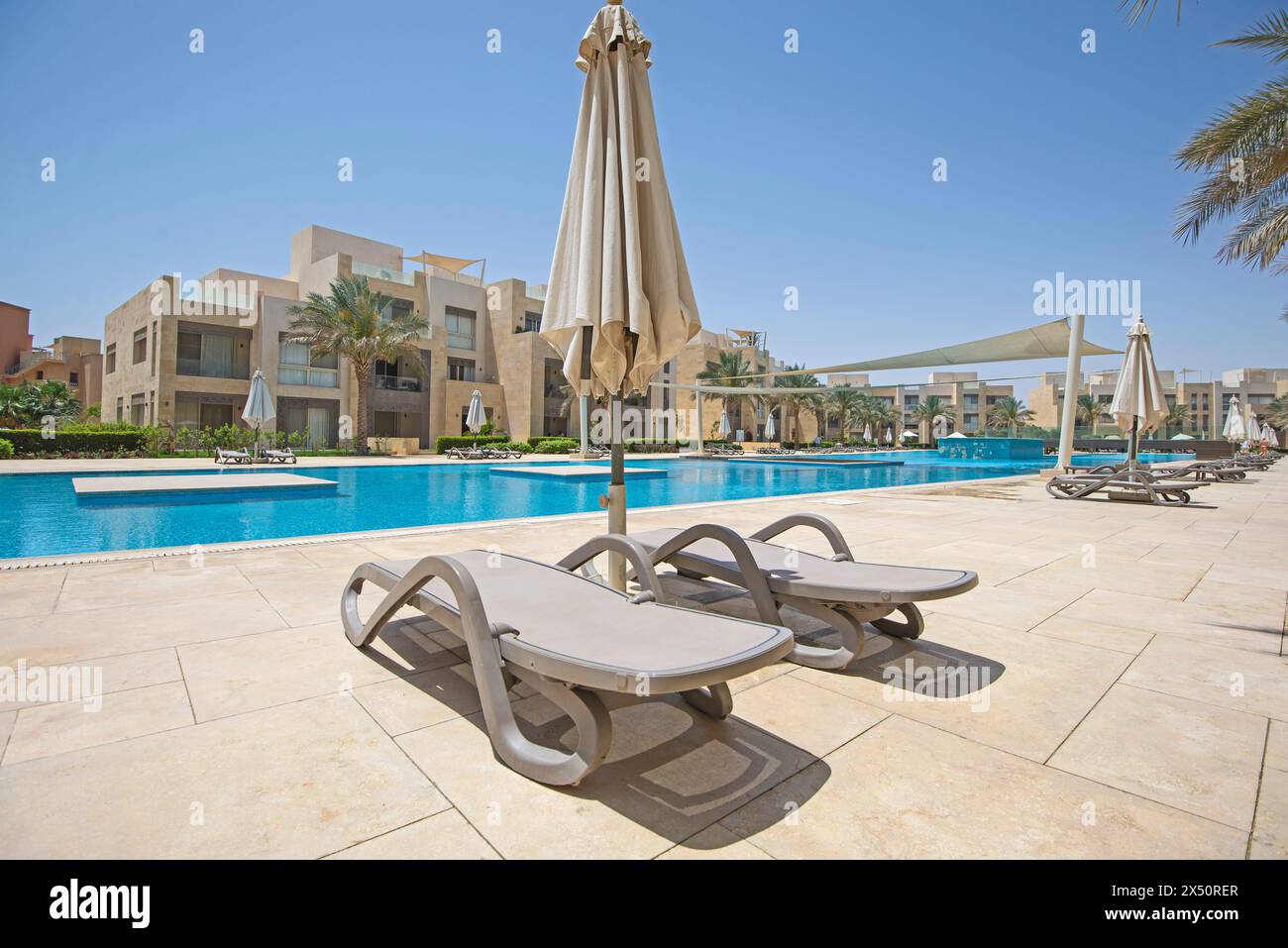 View of Luxury apartment in tropical resort with furniture and swimming pool ...