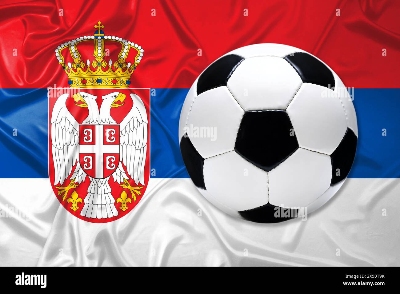 Black and white leather football with flag of Serbia Stock Photo