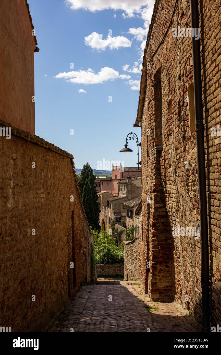 A beautiful view of the traditional houses of Certaldo Old Town - Certaldo Alto - in Tuscany, Italy. Sunny day with blue sky and no people in shot. Stock Photo