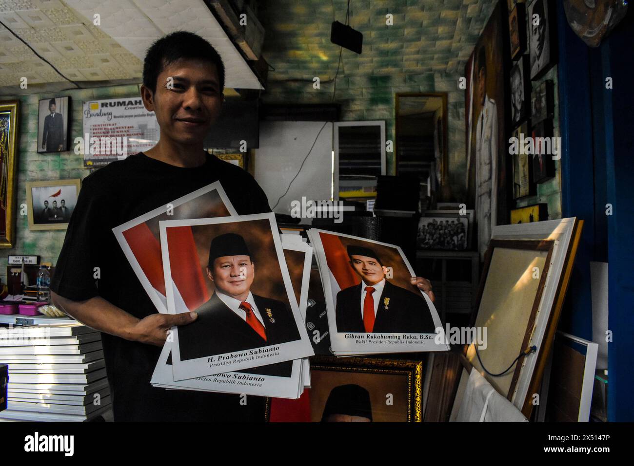 A trader sells framed photos of the President and Vice President of Indonesia elected for the 2024-2029 term of Prabowo Subianto and Gibran Rakabuming Raka in Bandung, West Java, Indonesia, on May 6, 2024. (Photo by Dimas Rachmatsyah/Sipa USA) Credit: Sipa USA/Alamy Live News Stock Photo