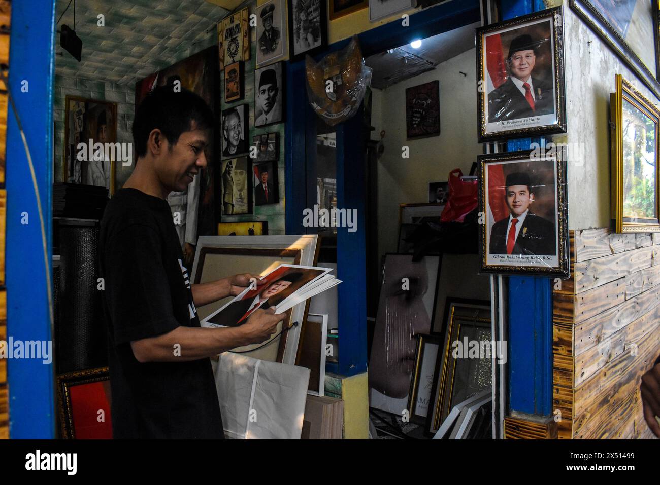 A trader sells framed photos of the President and Vice President of Indonesia elected for the 2024-2029 term of Prabowo Subianto and Gibran Rakabuming Raka in Bandung, West Java, Indonesia, on May 6, 2024. (Photo by Dimas Rachmatsyah/Sipa USA) Credit: Sipa USA/Alamy Live News Stock Photo