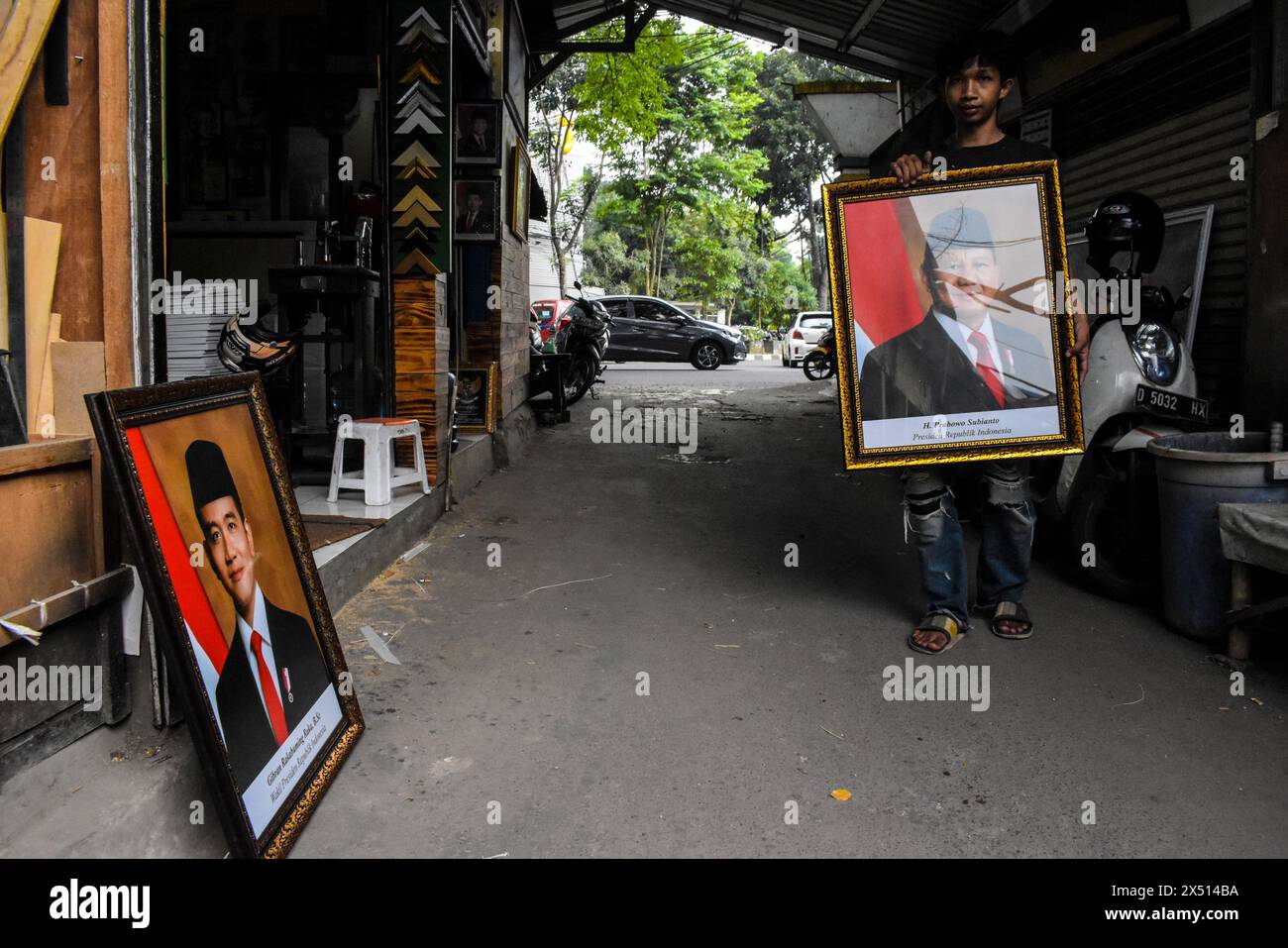 A trader sells framed photos of the President and Vice President of Indonesia elected for the 2024-2029 term of Prabowo Subianto and Gibran Rakabuming Raka in Bandung, West Java, Indonesia, on May 6, 2024. (Photo by Dimas Rachmatsyah/Sipa USA) Credit: Sipa USA/Alamy Live News Stock Photo