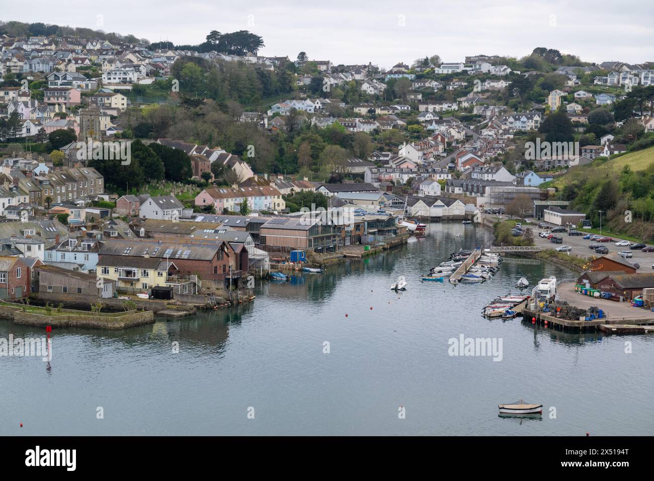 View from Snapes Point looking toward Batson Creek with Salcombe town, Church and boatyards in view, on calm spring day. Stock Photo