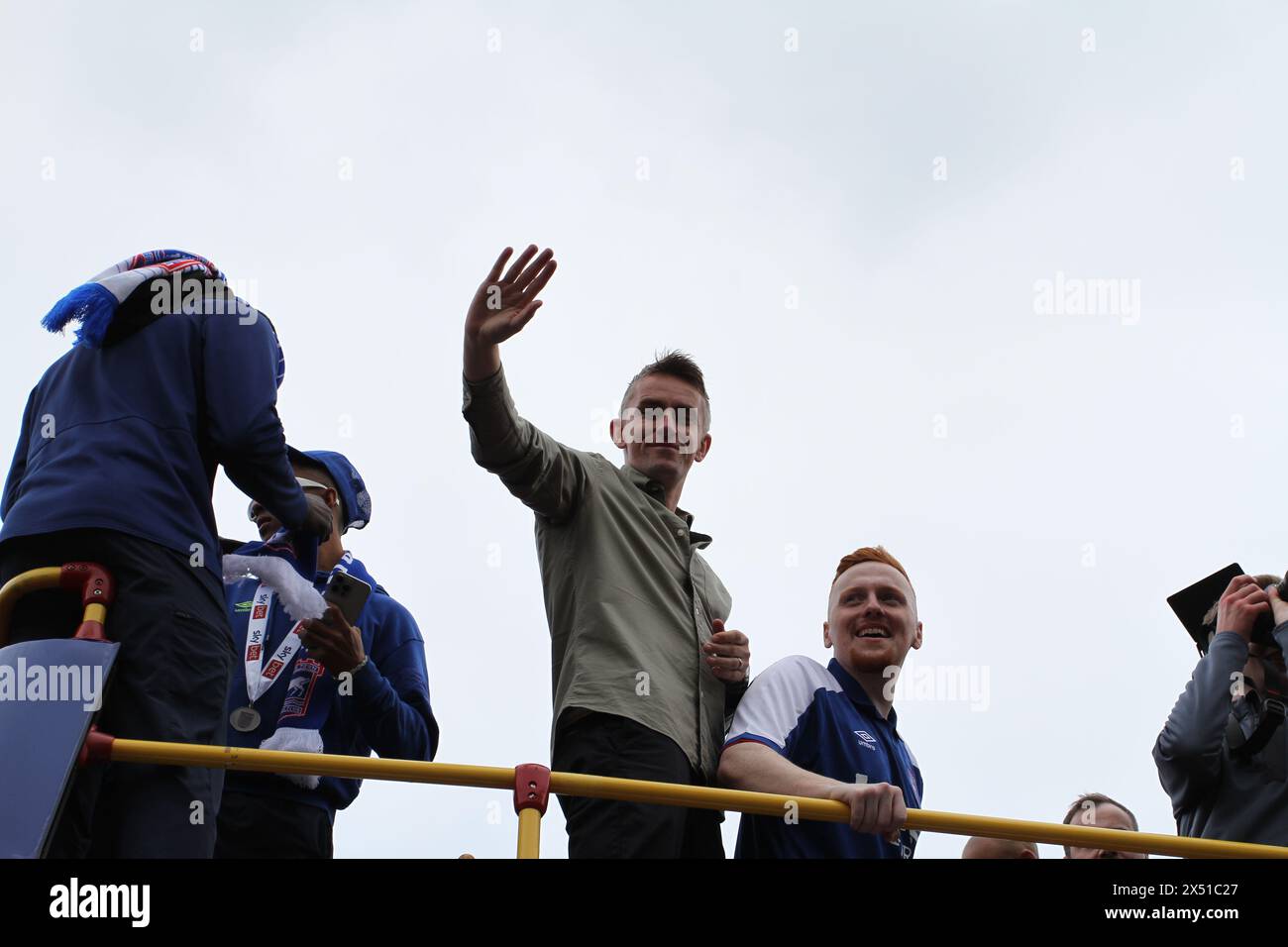 Ipswich, UK. 6th May, 2024. Ipswich Town Football Club celebrate back to back promotions, this season to the Premier League. Manager Kieran McKenna acknowledges the cheers of the crowd as he stands on the top of the parade bus and waves to the crowds below.  Credit:Eastern Views/Alamy Live News Stock Photo