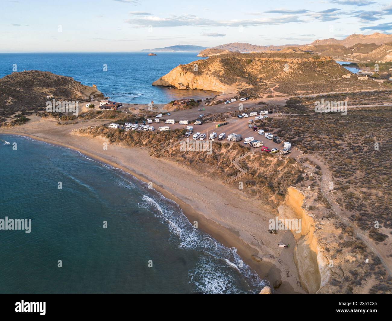 Aguilas, Spain; May 1st 2024: Motor homes and camper vans at Playa de la Carolina beach in Cuatro Calas, Aguilas, Murcia Stock Photo