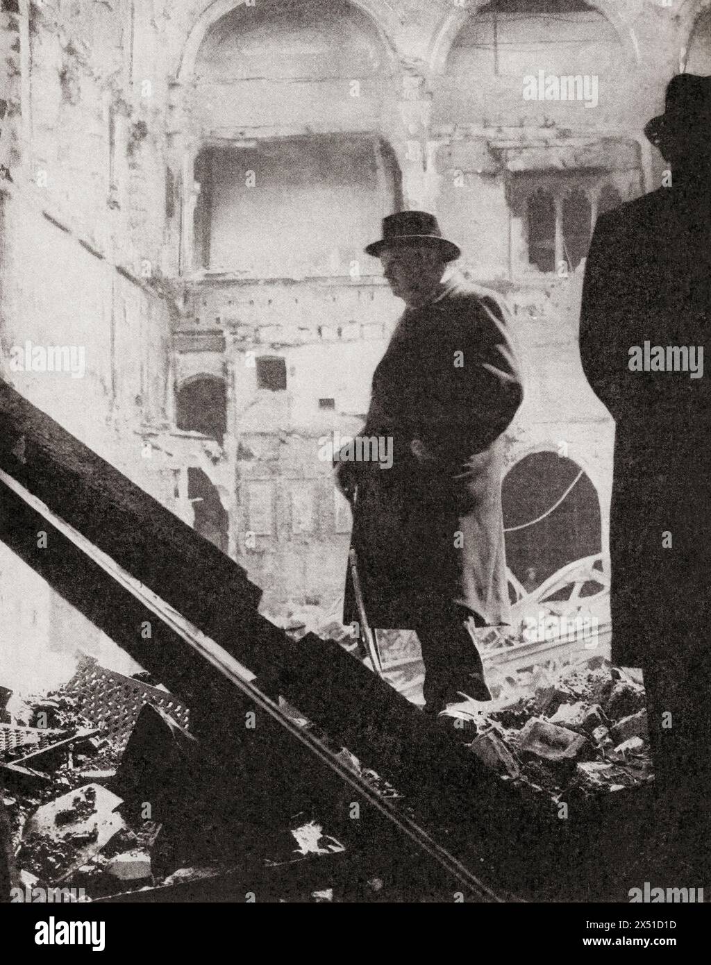 Winston Churchill inspects the ruins of part of the Houses of Parliament after London's severest air raid by German bombers, 10-11 May, 1941.  Sir Winston Leonard Spencer-Churchill, 1874 – 1965. British politician, army officer, writer and twice Prime Minister of the United Kingdom.  From The War in Pictures, Second Year. Stock Photo