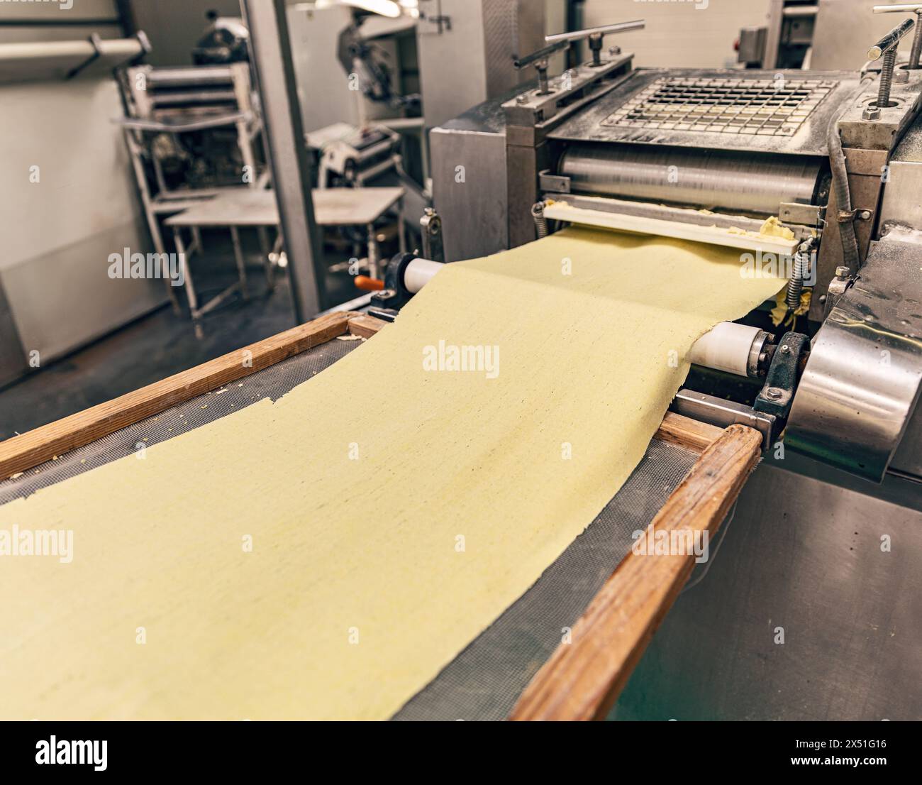 Industrial pasta production conveyor belt, Pasta factory concept Stock Photo