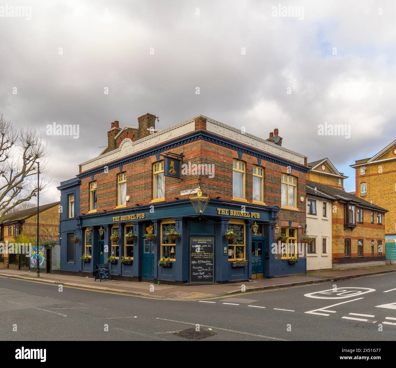 Facade of The Brunel Pub in the Canada Water neighborhood on Rotherhithe Street before nightfall, in the afternoon under a cloudy sky. Stock Photo