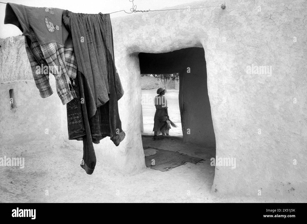 Moroccan woman hanging laundry Stock Photo