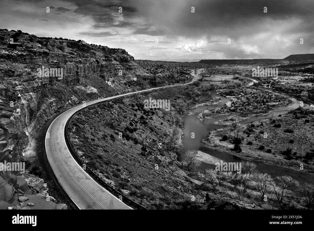 A road winds along the Rio Chama, NM Stock Photo