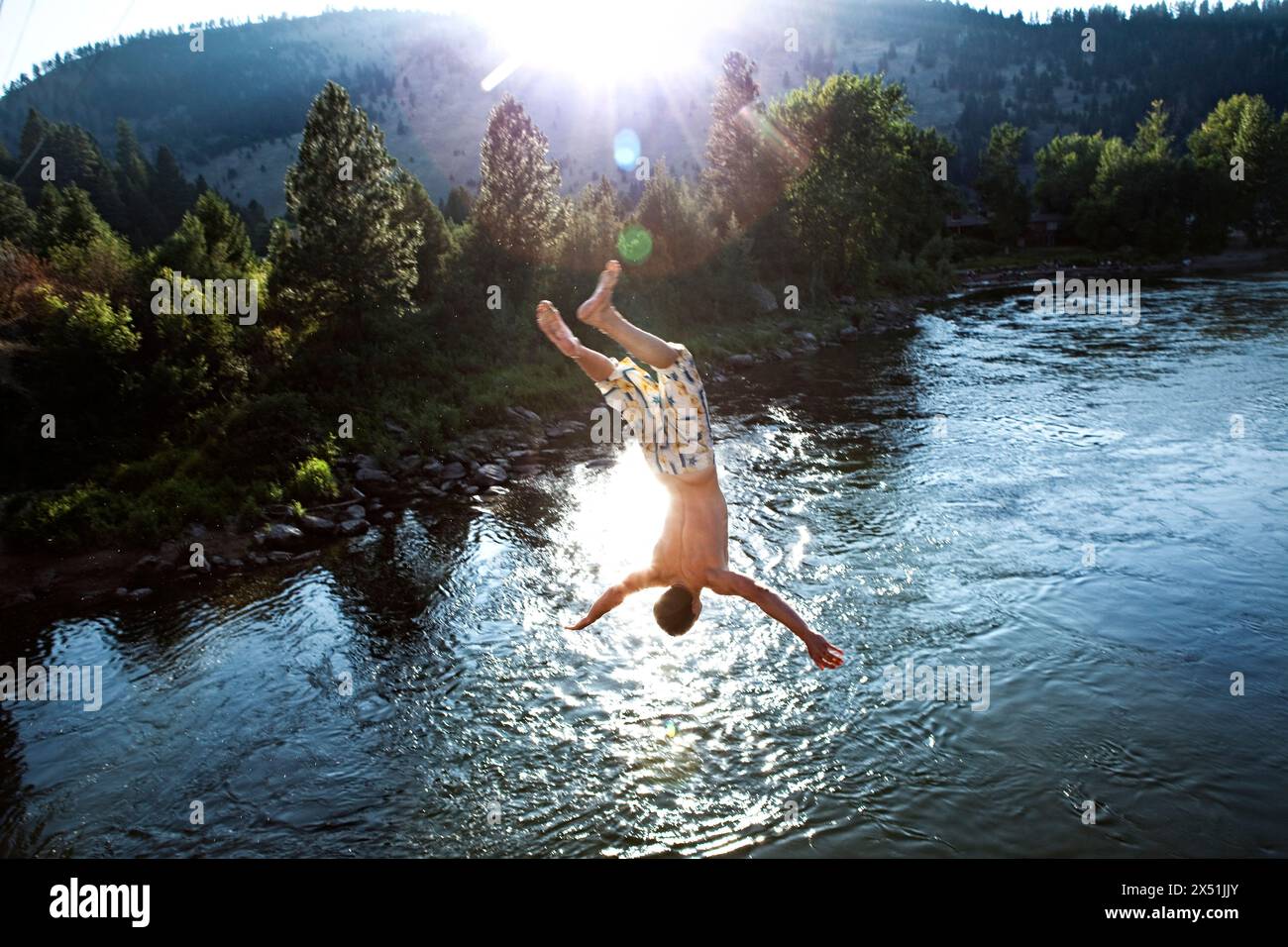 Boys jumping into river hi-res stock photography and images - Alamy