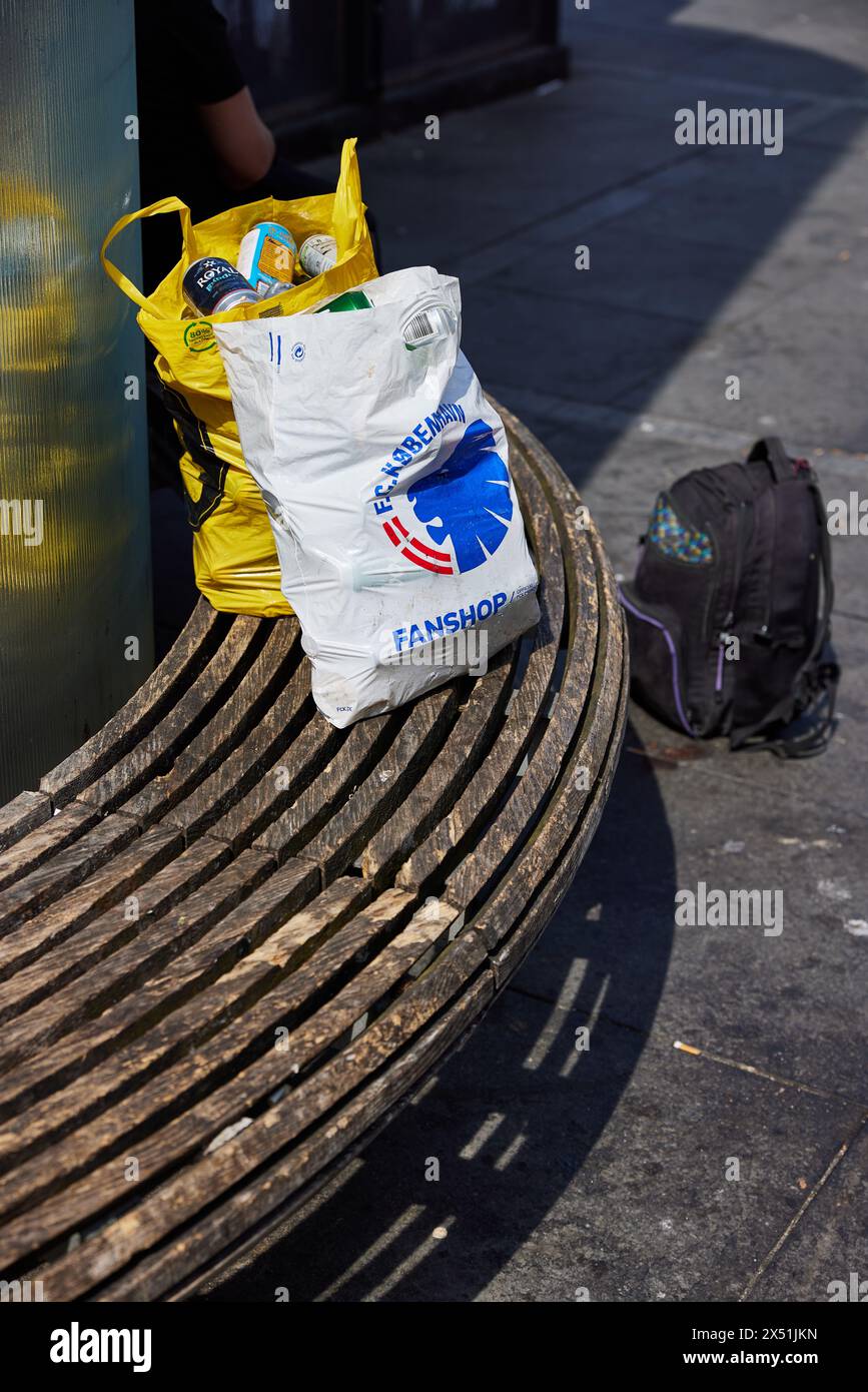 Plastic Bags Full Of Empty Beer Cans On A Bench At N rreport plastic-bags-full-of-empty-beer-cans-on-a-bench-at-n-rreport