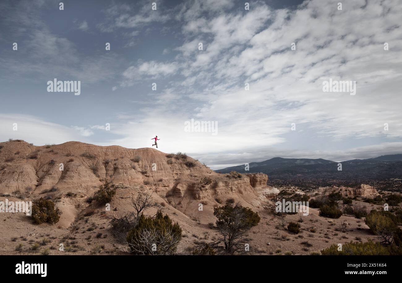 Woman jumps from hill hi-res stock photography and images - Alamy