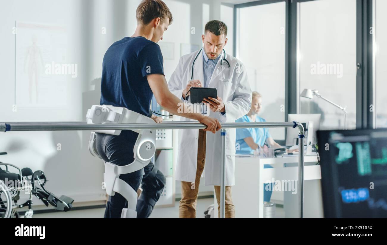 Modern Hospital Physical Therapy: Doctor Uses Tablet Computer, Helps Disabled Patient with Injury Walk on Treadmill Wearing Advanced Robotic Exoskeleton Legs. Physiotherapy Rehabilitation Technology Stock Photo