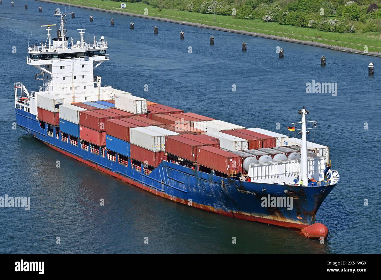 Containership PERSEUS passing the Kiel Canal Stock Photo