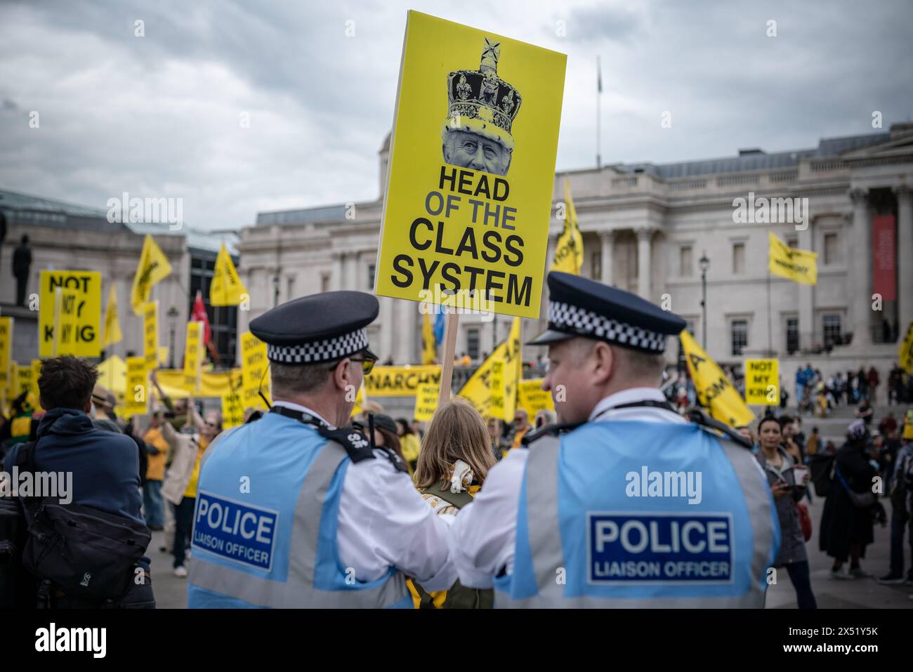 London, UK. 5th May 2024. Anti-monarchy campaign group Republic hold a rally in London’s Trafalgar Square ahead of the anniversary of King Charles’s coronation. About 100 people attend with parallel events in Edinburgh and Cardiff calling for the abolition of the monarchy. It will be a year since the king’s coronation on Monday, when gun salutes across the capital will commemorate his reign. Protesters chant “Abdicate, abdicate” in front of two large yellow banners that read “Abolish the monarchy” and “Change the country for good.” Credit: Guy Corbishley/Alamy Live News Stock Photo