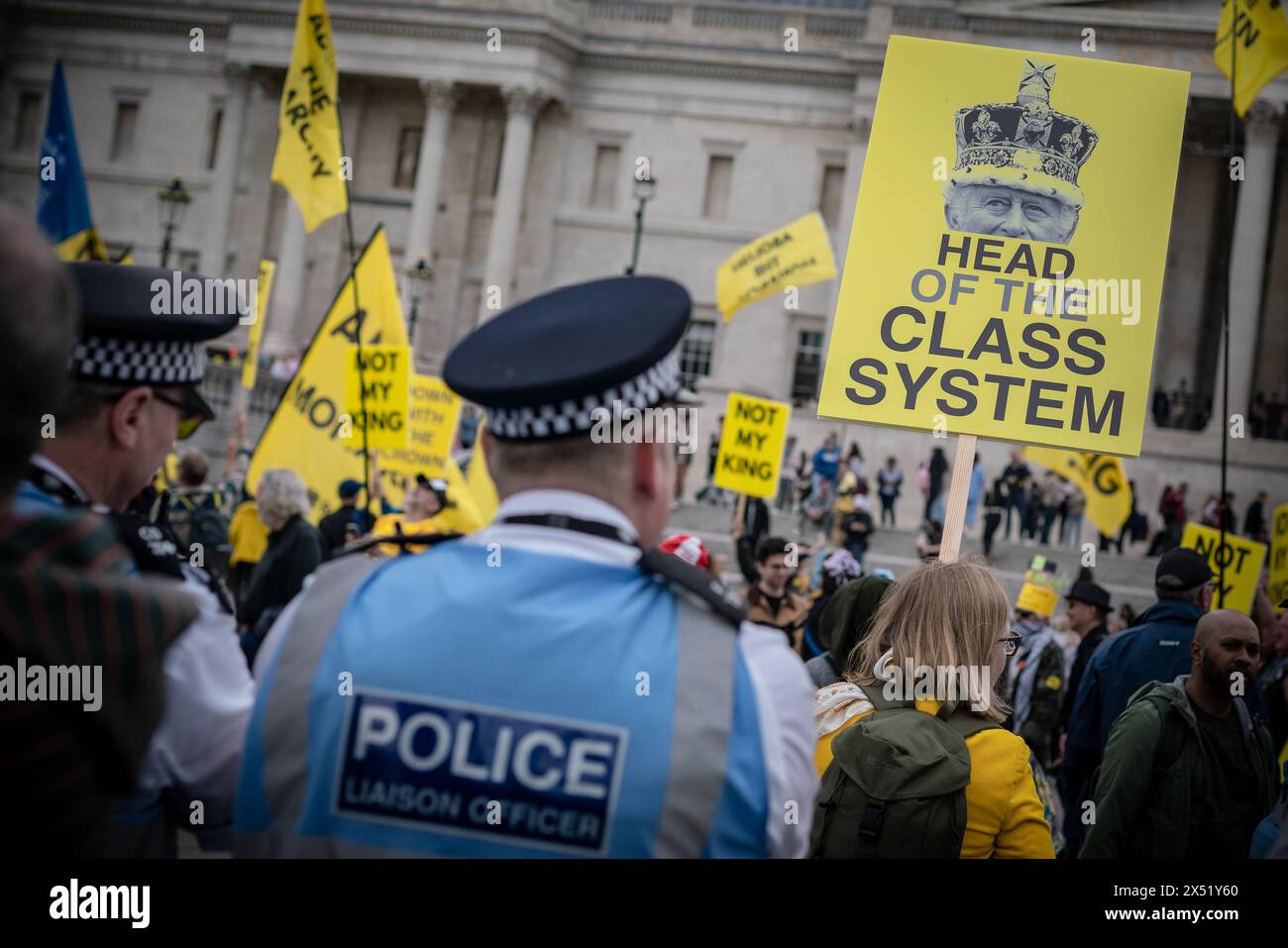 London, UK. 5th May 2024. Anti-monarchy campaign group Republic hold a rally in London’s Trafalgar Square ahead of the anniversary of King Charles’s coronation. About 100 people attend with parallel events in Edinburgh and Cardiff calling for the abolition of the monarchy. It will be a year since the king’s coronation on Monday, when gun salutes across the capital will commemorate his reign. Protesters chant “Abdicate, abdicate” in front of two large yellow banners that read “Abolish the monarchy” and “Change the country for good.” Credit: Guy Corbishley/Alamy Live News Stock Photo