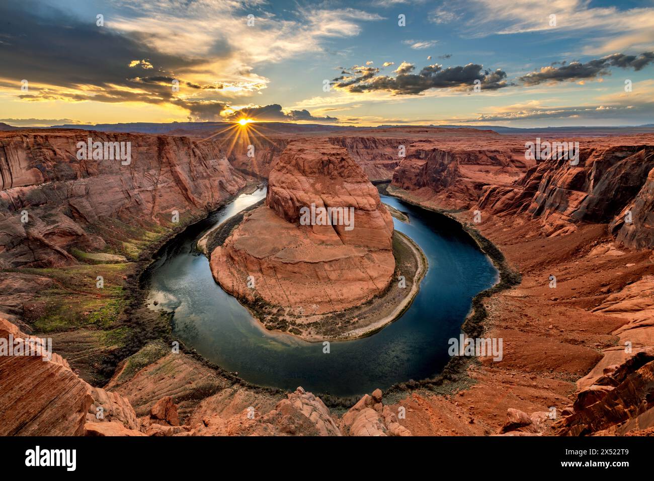 Super panorama of Horseshoe Bend in Page Arizona shows the pink inversion layer and the dramatic horseshoe shape from which the Colorado River flows. Stock Photo