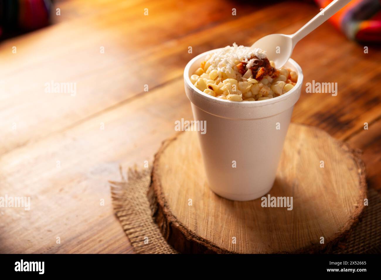 Esquites. Corn kernels cooked and served with mayo, sour cream, lemon