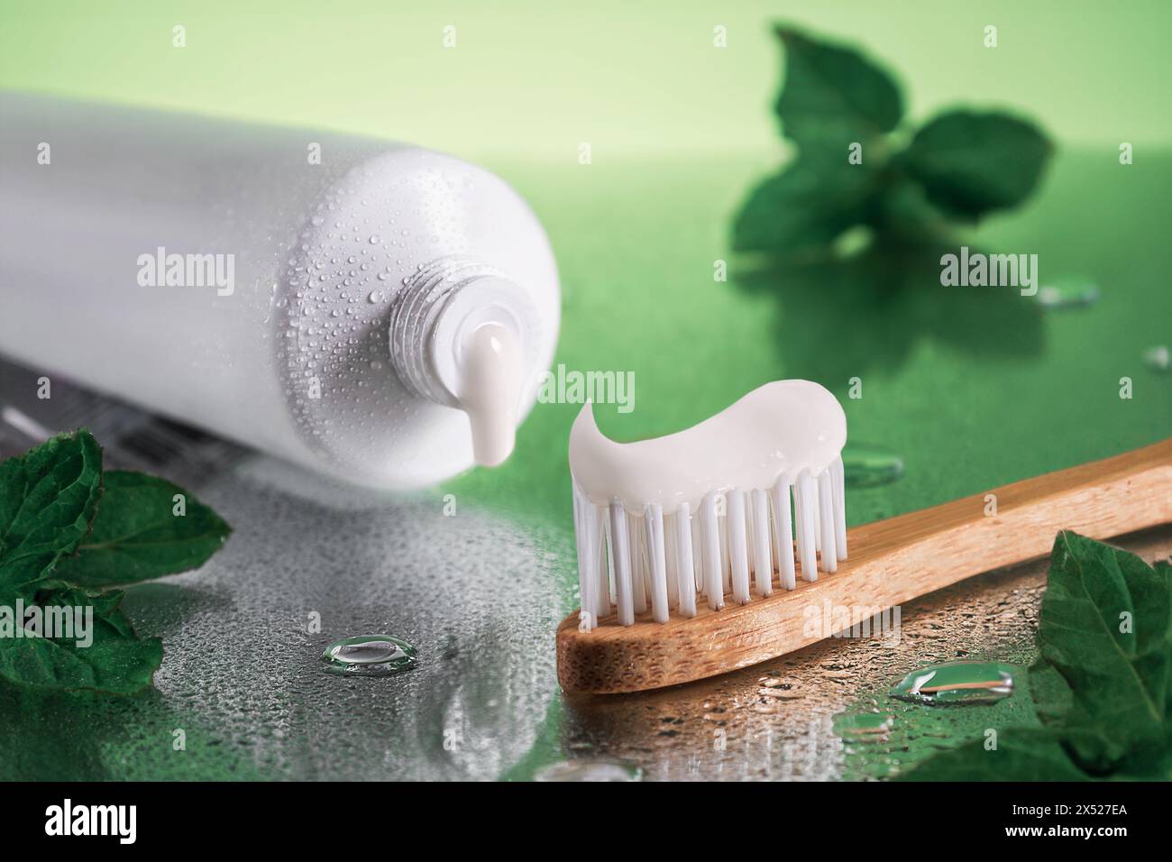 Closeup tube of toothpaste and bamboo toothbrush.Concept oral health and care. Stock Photo
