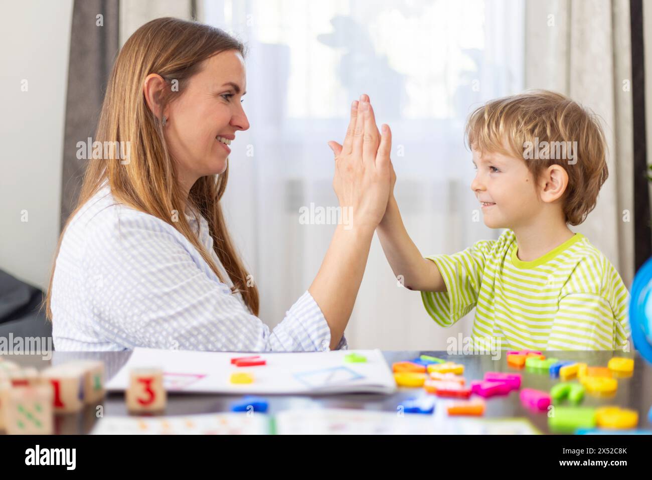 High 5 Approach Child Development High Five in a Children's Educational Setting Stock Photo - Alamy