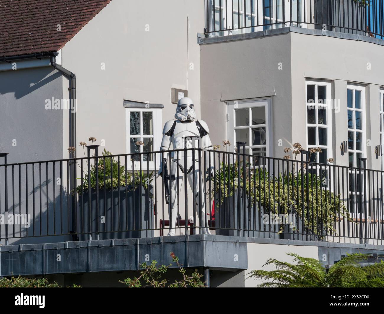 A Star Wars Stormtrooper suit standing on a balconey of a house in Barnes, London, UK. Stock Photo