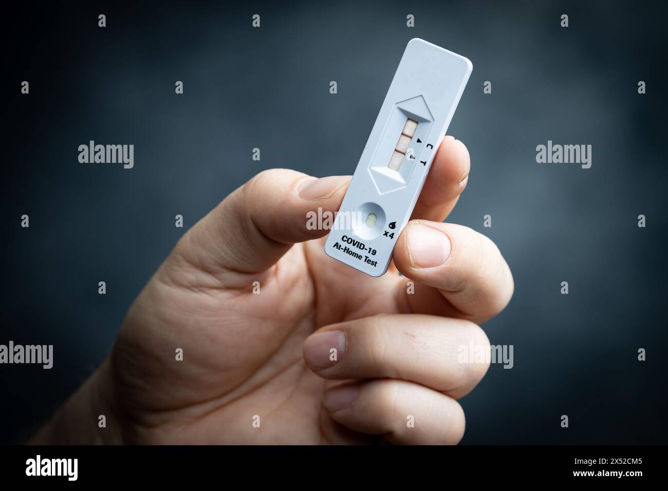 COVID-19 home test with positive result indicated Stock Photo