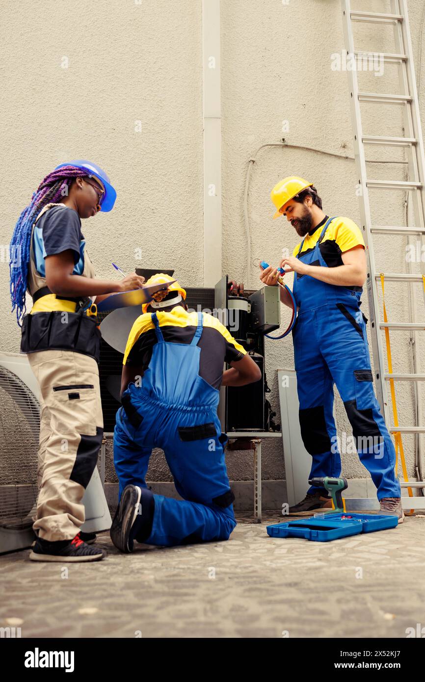 Diverse crew hired by home owner to service faulty air conditioner