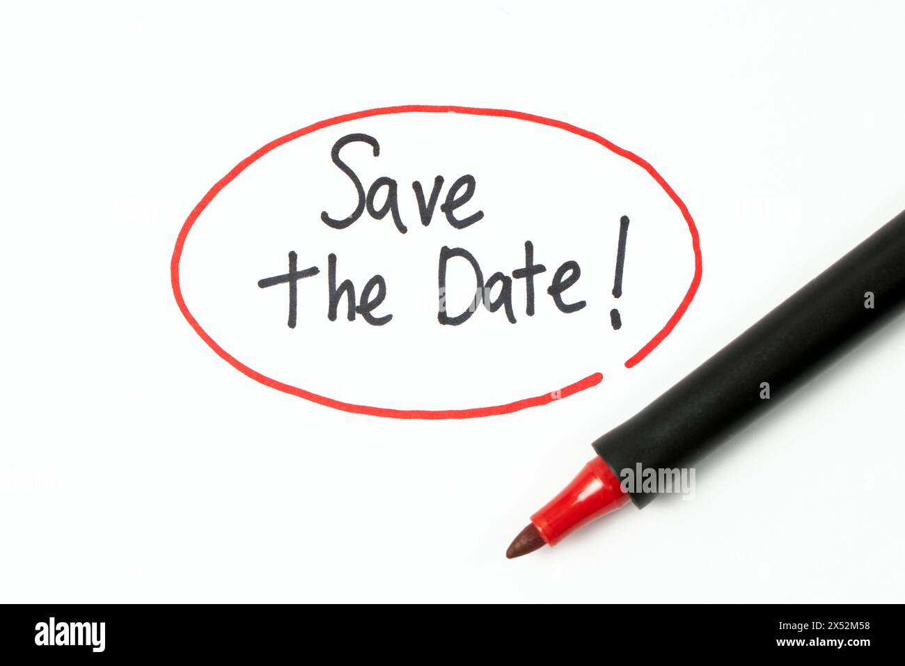 Hand writing text save the date with red marker pen Stock Photo