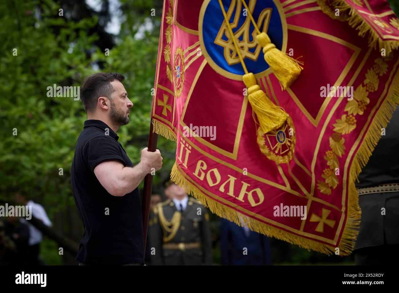 Kyiv, Ukraine. 06th May, 2024. Ukrainian President Volodymyr Zelenskyy, left, awards a battle flag to hero military units during Infantry Day celebrations on Constitution Square, May 6, 2024, in Kyiv, Ukraine. Credit: Ukraine Presidency/Ukrainian Presidential Press Office/Alamy Live News Stock Photo
