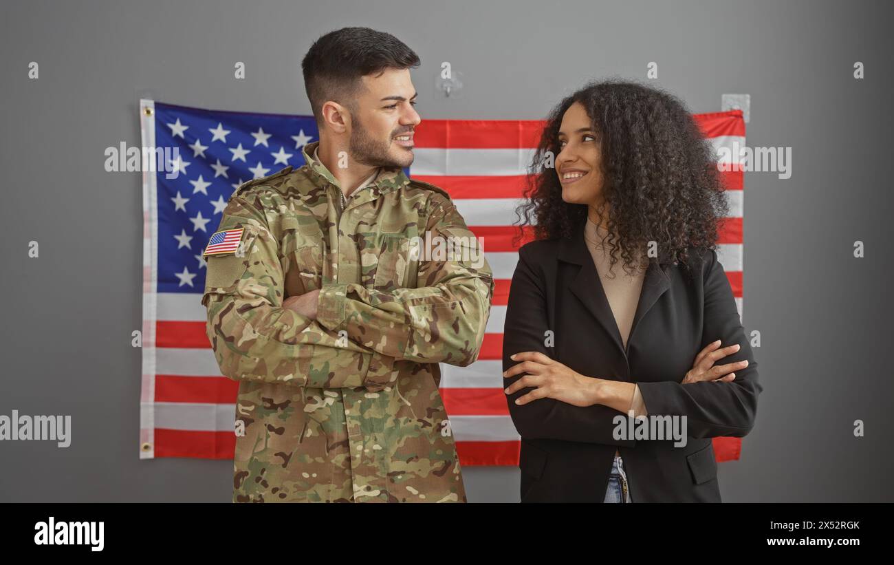 A smiling man in military uniform and a businesswoman with an american ...