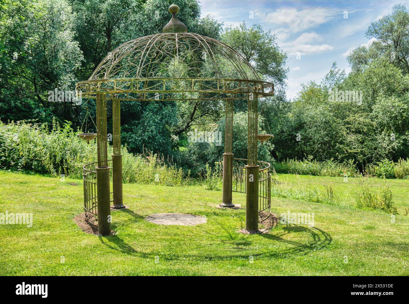 Wrought Iron Kiosk , in a public park , Kiosque precious furnishing elements , elegance harking back to classical style, uk summer Stock Photo
