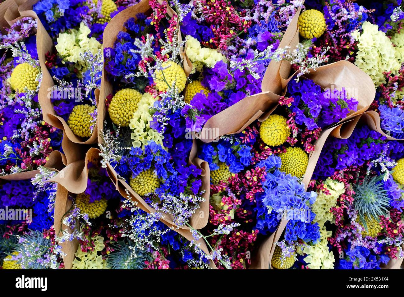 Several bundled flower arrangements in vivid shades of purple and yellow, flower sale, Central Station, Hamburg, Hanseatic City of Hamburg, Germany Stock Photo