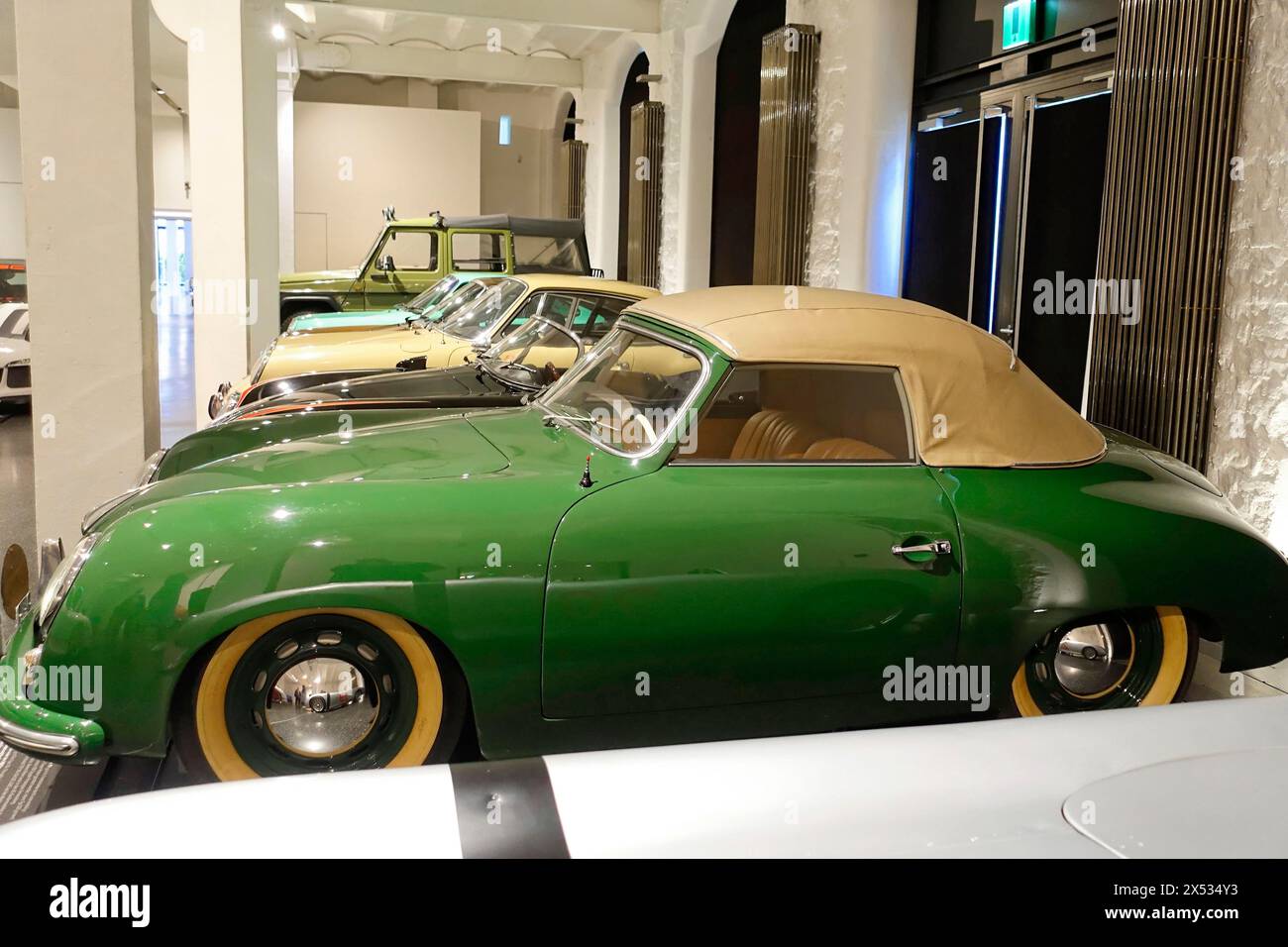 A green classic Porsche Cabriolet in an automobile exhibition, AUTOMUSEUM PROTOTYP, Hamburg, Hanseatic City of Hamburg, Germany Europe Stock Photo