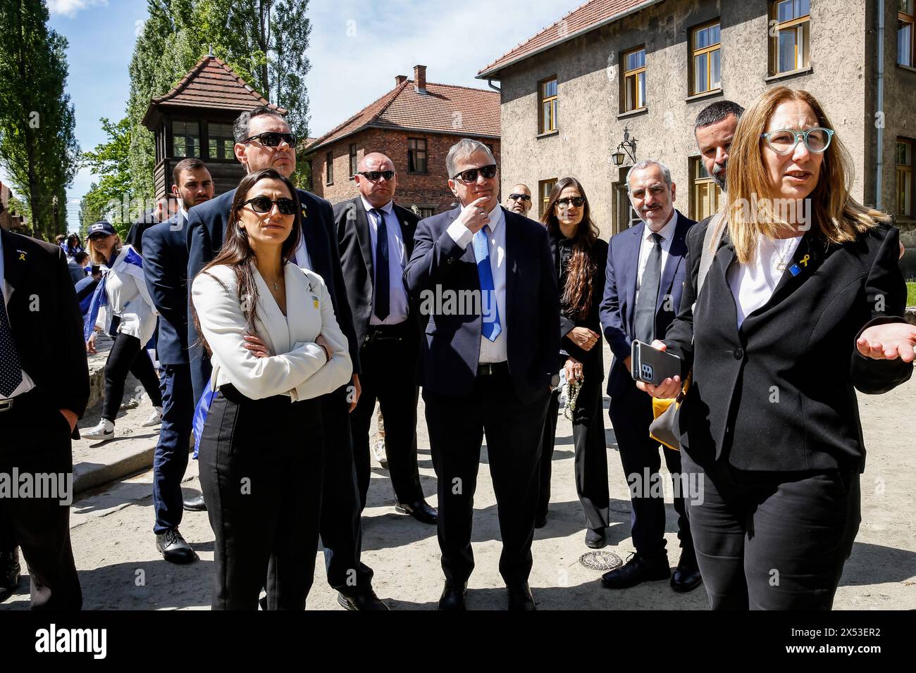 Yoav Kisch, Minister of Education of Israel (C) visits exhibitions as he arrives for the March of the Living at Auschwitz Camp gate 'Work Makes you Free', with 55 Holocaust survivors participating. Holocaust survivors and October 7th survivors attend the March of the Living together with a delegation from, among others, the United States, Canada, Italy, United Kingdom. On Holocaust Memorial Day observed in the Jewish calendar (Yom HaShoah), thousands of participants march silently from Auschwitz to Birkenau. The march has an educational and remembrance purpose. This year's March was highly pol Stock Photo