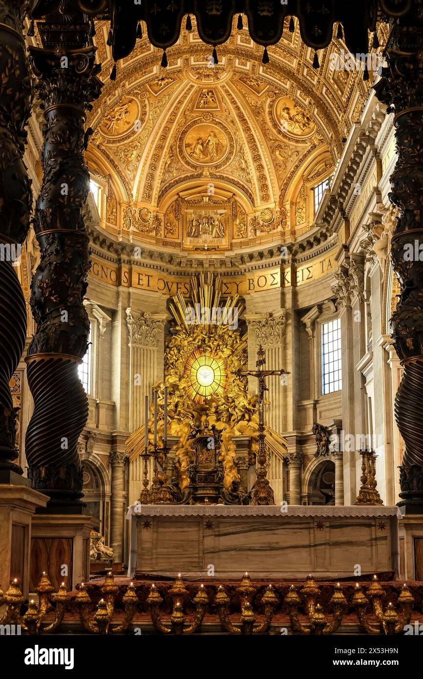 Detail of the Altar of the Chair of St. Peter, framed by the Papal Altar & Baldacchino, located within Saint Peter's Basilica in Vatican City Stock Photo