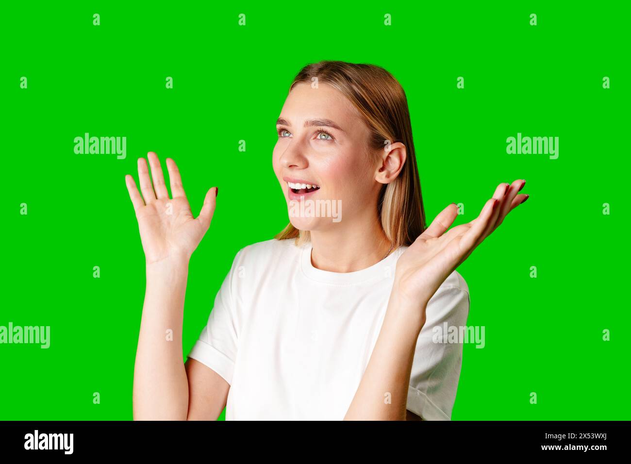 Young Woman in White T-shirt Making a Surprised Face Stock Photo