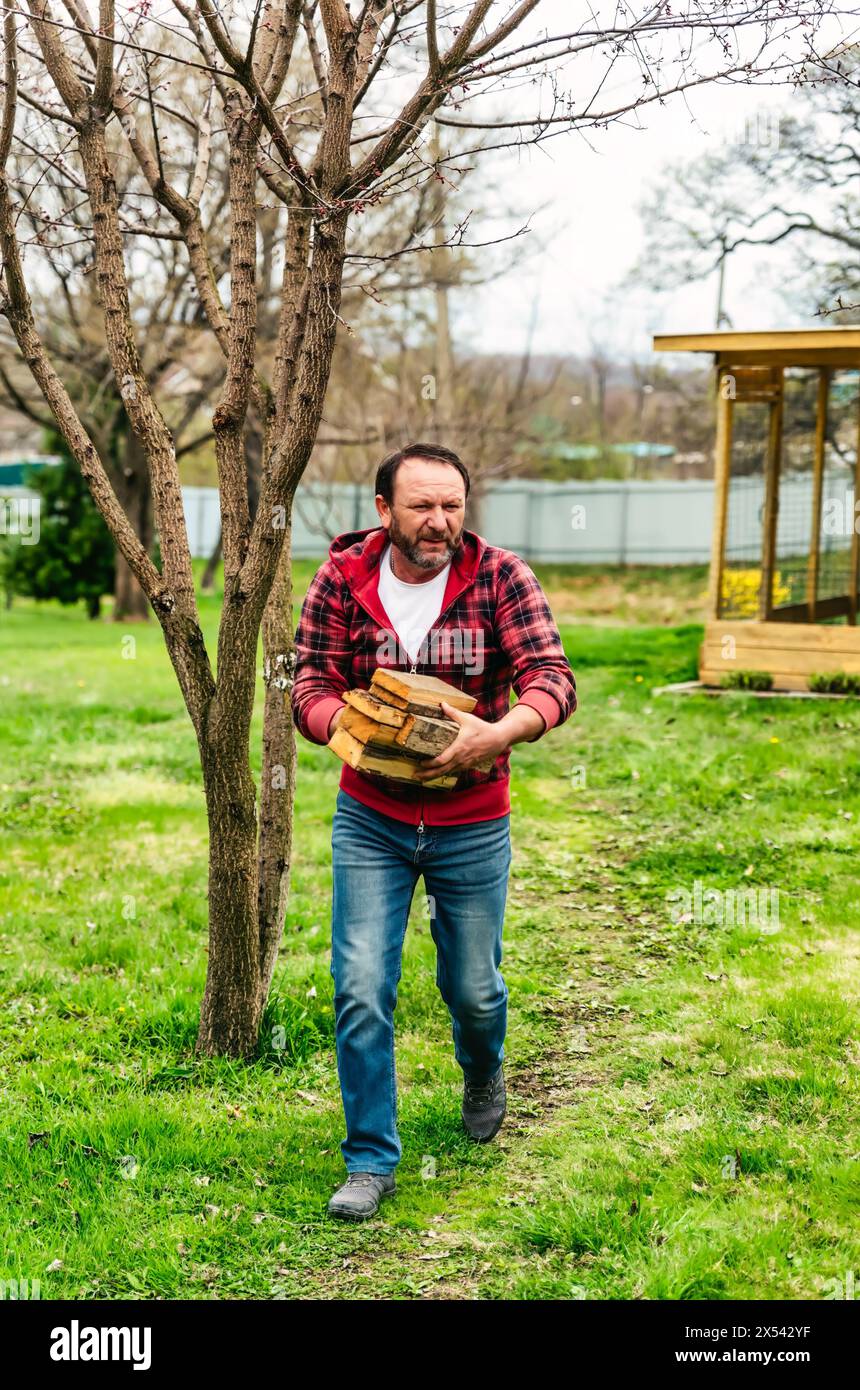 Mature male farmer carries hi-res stock photography and images - Alamy