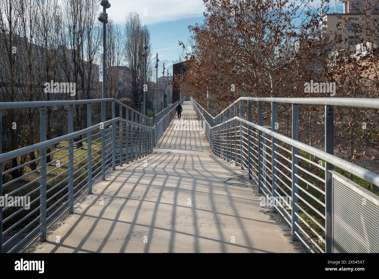 Infinity perspective of pedestrian walkway at Dora park in Turin, Italy. Stock Photo