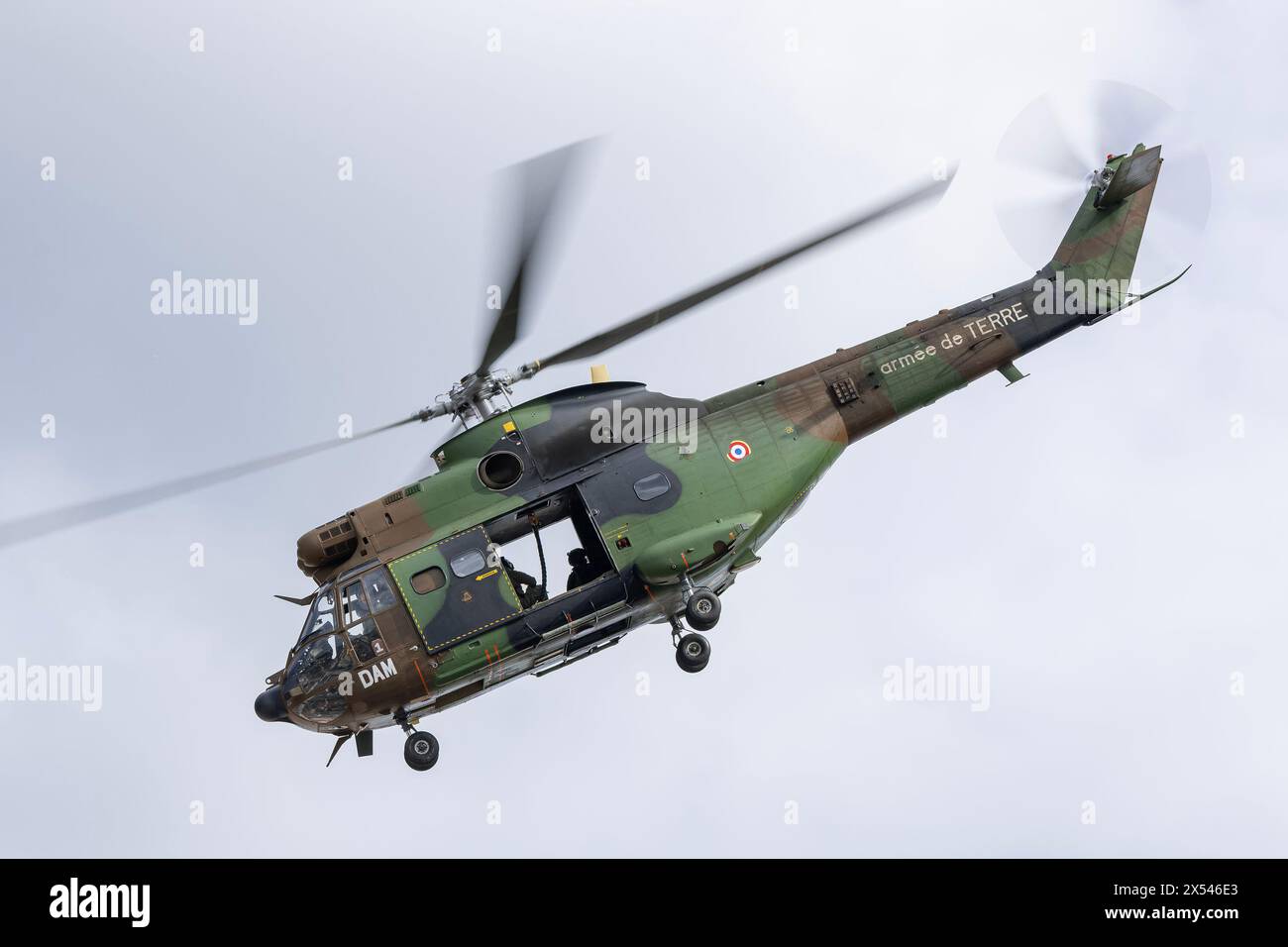 View on a helicopter Aérospatiale SA-330B Puma from French Army for an exercise to drop members of the RAID by helicopter on the roof of a building. Stock Photo