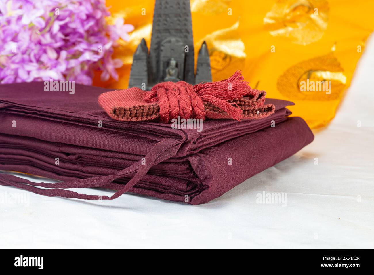 Kāṣāya are the robes of fully ordained Buddhist monks. In Sanskrit and Pali cīvara. constructed of discarded fabric. antarvasa, uttarasanga and samgha Stock Photo