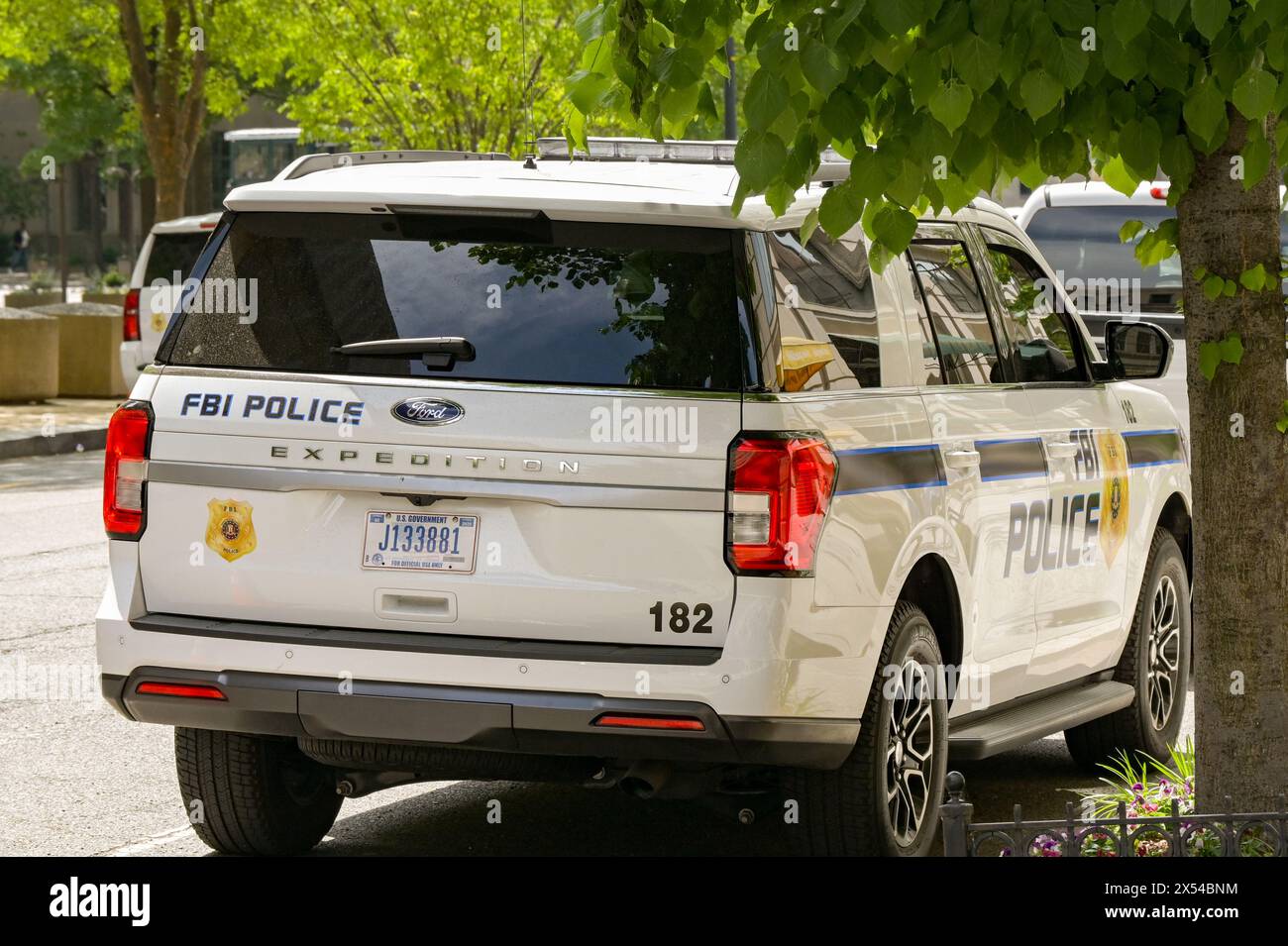Washington DC, USA - 30 April 2024: Police patrol car used by the FBI parked on a street outside the J Edgar Hoover headquarters building Stock Photo