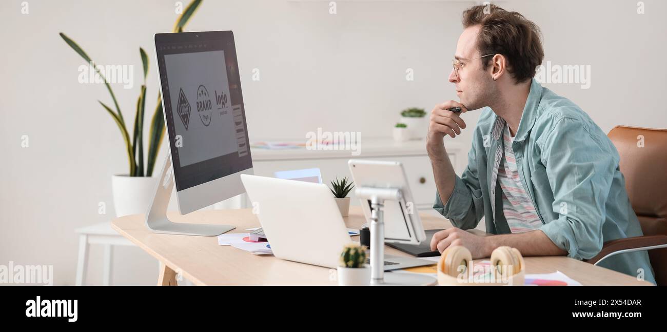 Male graphic designer developing logotype in office Stock Photo