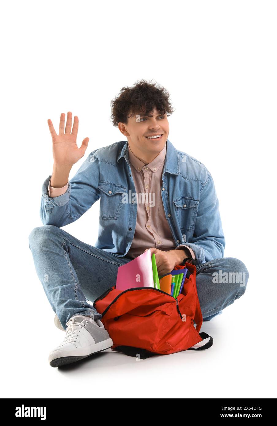 Male student with backpack waving hand on white background Stock Photo ...