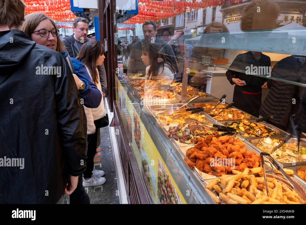 Eat as much as you like hot buffet at a Chinese restaurant in Chinatown on 6th May 2024 in London, United Kingdom. Many people eat bargain food responsibly and it provides great value for consumers, however concerns over obesity levels in the UK remain, especially with foods containing high levels of fat and sugar. Obesity is a medical condition in which excess body fat has accumulated to the extent that it may have a negative effect on health. Stock Photo