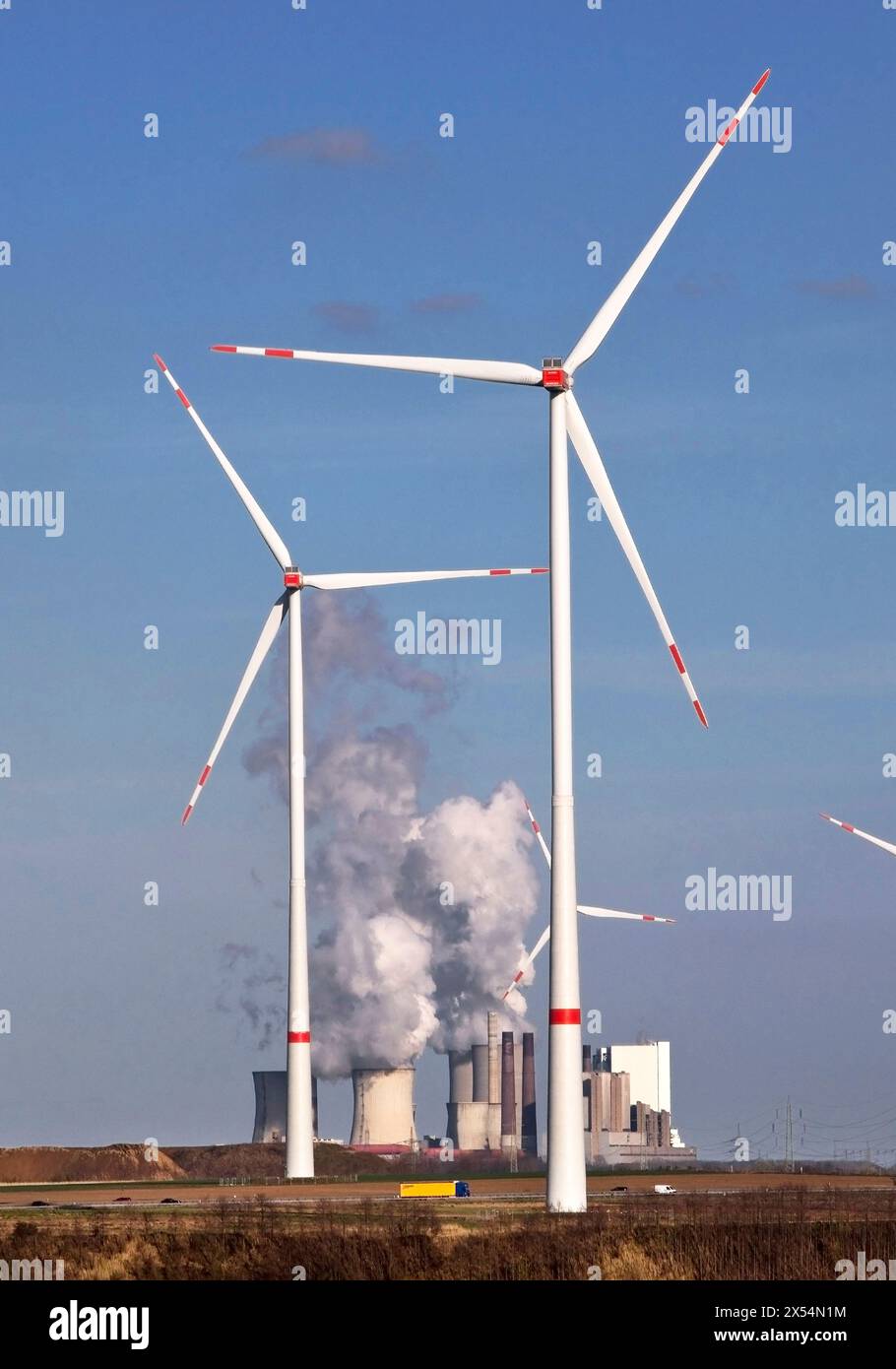 wind turbines with the Neurath power plant, Germany, North Rhine-Westphalia, Rhineland, Juechen Stock Photo